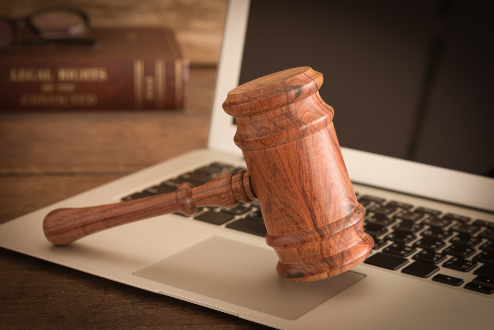 Crypto Law Firm Files Suit Against Owner of Coin Signals