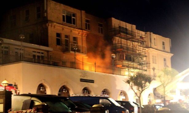 Firefighters work to contain the blaze at the Atlantic Hotel.